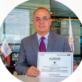 AMC CEO holding the Silver Jubilee certificate